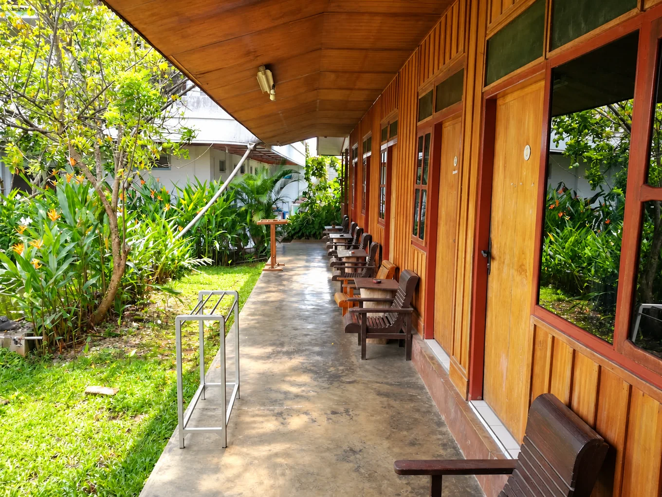 Garden and wooden veranda at Victory Tentena
